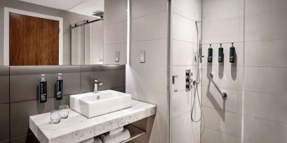 Guest bathroom with shower at DoubleTree By Hilton Lincoln.