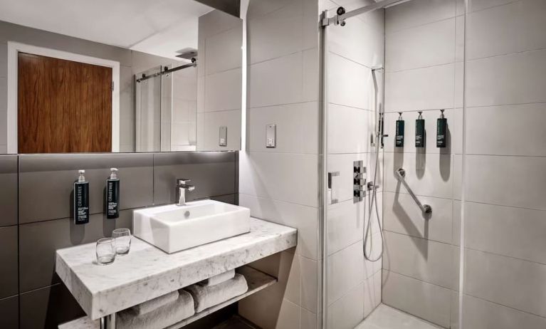 Guest bathroom with shower at DoubleTree By Hilton Lincoln.