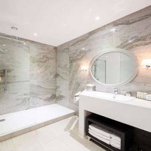 Guest bathroom with shower at DoubleTree By Hilton Edinburgh City Centre.