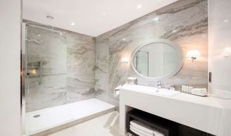 Guest bathroom with shower at DoubleTree By Hilton Edinburgh City Centre.