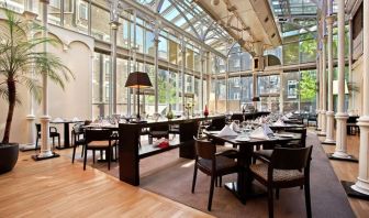 Dining area with natural light at Hilton London Euston.