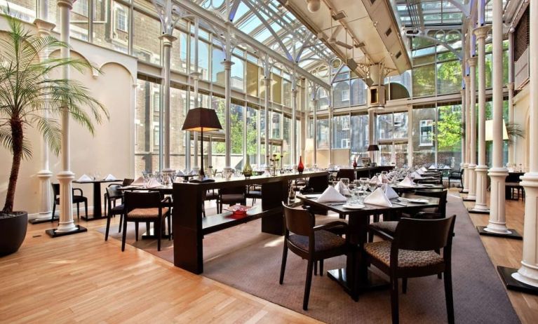 Dining area with natural light at Hilton London Euston.