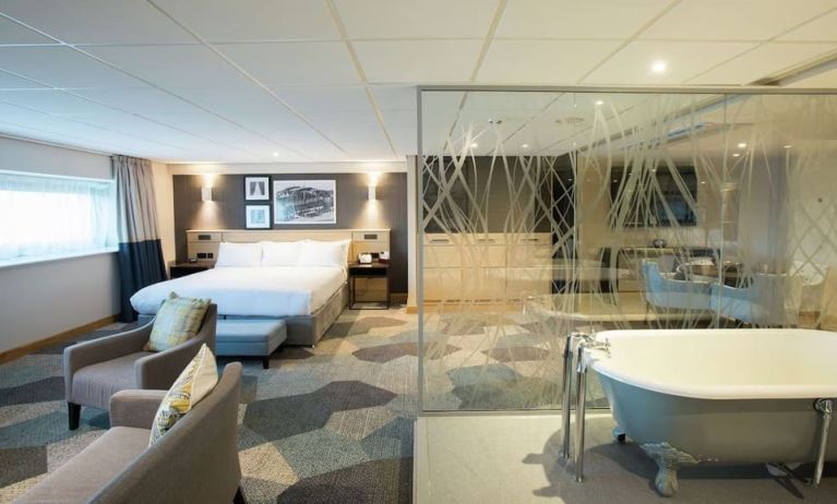 Spacious day use room with living area and tub at DoubleTree By Hilton Coventry Building Society Arena.