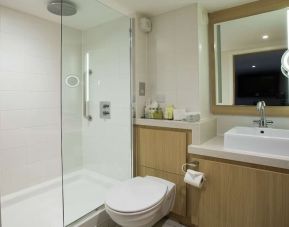 Guest bathroom with shower at DoubleTree By Hilton Coventry Building Society Arena.