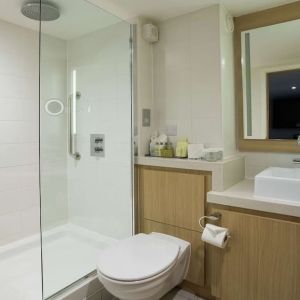 Guest bathroom with shower at DoubleTree By Hilton Coventry Building Society Arena.