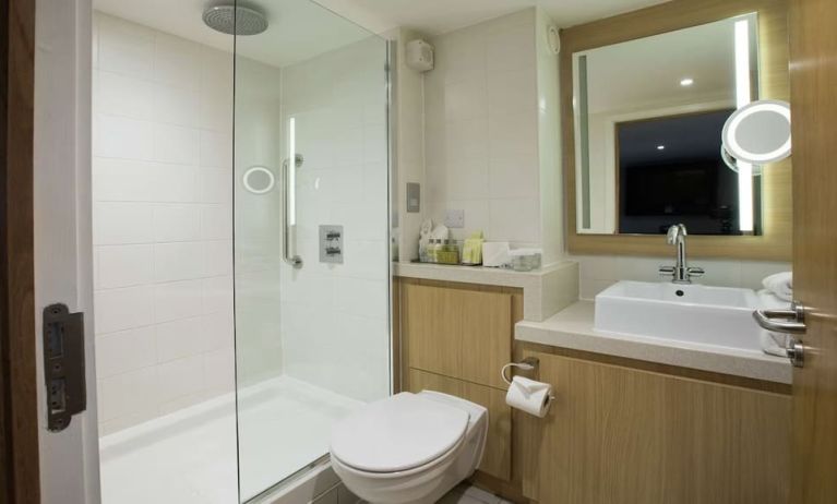 Guest bathroom with shower at DoubleTree By Hilton Coventry Building Society Arena.