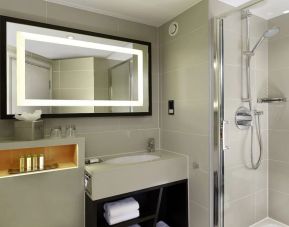 Guest bathroom with shower at DoubleTree By Hilton London - Ealing.