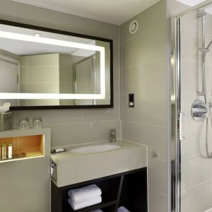 Guest bathroom with shower at DoubleTree By Hilton London - Ealing.