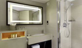 Guest bathroom with shower at DoubleTree By Hilton London - Ealing.