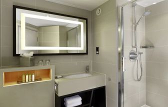 Guest bathroom with shower at DoubleTree By Hilton London - Ealing.