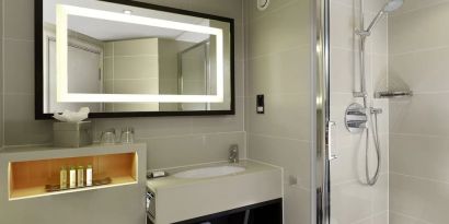 Guest bathroom with shower at DoubleTree By Hilton London - Ealing.