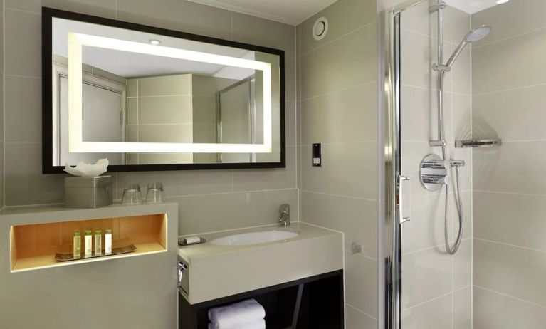 Guest bathroom with shower at DoubleTree By Hilton London - Ealing.