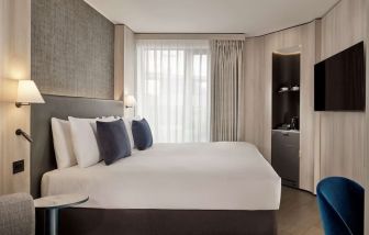 Elegant day room with natural light at The Westminster London, Curio Collection By Hilton.  