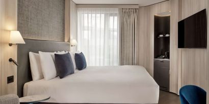 Elegant day room with natural light at The Westminster London, Curio Collection By Hilton.  