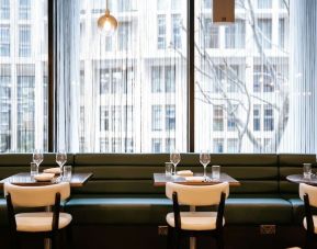 Hotel bar seating with natural light at The Westminster London, Curio Collection By Hilton.  