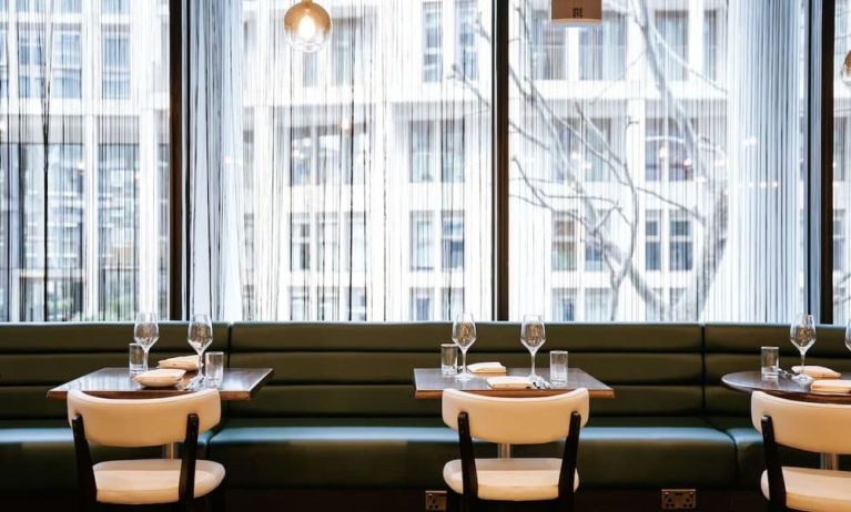 Hotel bar seating with natural light at The Westminster London, Curio Collection By Hilton.  