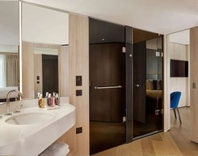 Guest bathroom with shower at The Westminster London, Curio Collection By Hilton.
