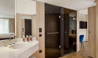 Guest bathroom with shower at The Westminster London, Curio Collection By Hilton.
