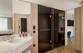 Guest bathroom with shower at The Westminster London, Curio Collection By Hilton.
