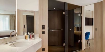 Guest bathroom with shower at The Westminster London, Curio Collection By Hilton.
