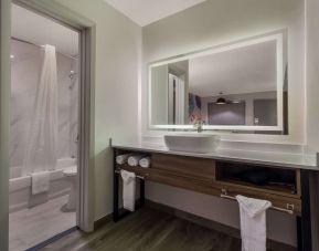 Private bathroom with shower at Signature Inn Houston Galleria.