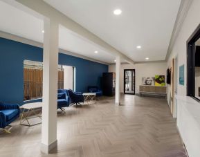 Lobby and coworking space at Signature Inn Houston Galleria.