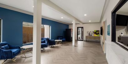 Lobby and coworking space at Signature Inn Houston Galleria.