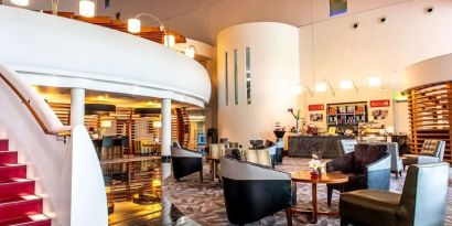 Lobby and coworking lounge at Hilton London Heathrow Airport Terminal 5.