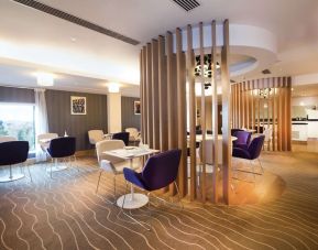 Lobby and coworking lounge at Hilton London Heathrow Airport Terminal 5.