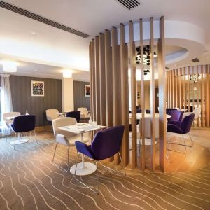 Lobby and coworking lounge at Hilton London Heathrow Airport Terminal 5.