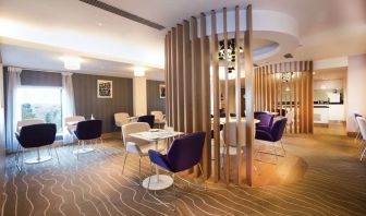 Lobby and coworking lounge at Hilton London Heathrow Airport Terminal 5.