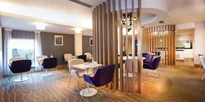 Lobby and coworking lounge at Hilton London Heathrow Airport Terminal 5.