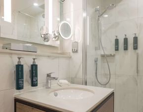 Guest bathroom with shower at DoubleTree By Hilton Manchester Airport.