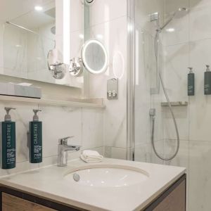 Guest bathroom with shower at DoubleTree By Hilton Manchester Airport.