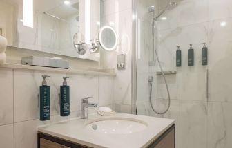 Guest bathroom with shower at DoubleTree By Hilton Manchester Airport.