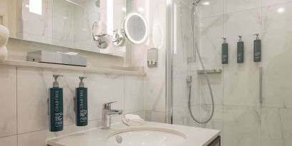 Guest bathroom with shower at DoubleTree By Hilton Manchester Airport.