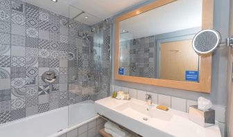 Guest bathroom with shower at Hilton Bournemouth.  