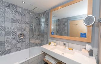 Guest bathroom with shower at Hilton Bournemouth.  