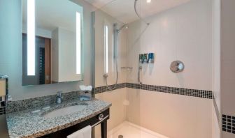 Guest bathroom with shower at Hampton By Hilton London Luton Airport.