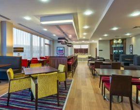 Dining area perfect for coworking at Hampton By Hilton London Luton Airport. 