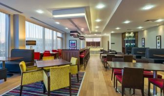 Dining area perfect for coworking at Hampton By Hilton London Luton Airport. 