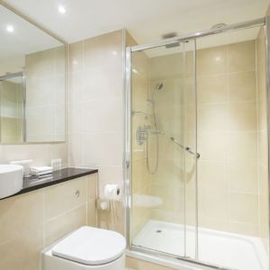 Guest bathroom with shower at DoubleTree By Hilton Hotel & Spa Chester.