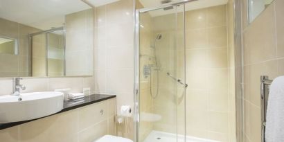 Guest bathroom with shower at DoubleTree By Hilton Hotel & Spa Chester.