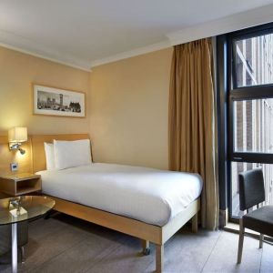 Day use room with furniture at Hilton London Kensington.
