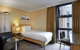 Day use room with furniture at Hilton London Kensington.
