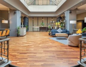 Lobby and coworking lounge at Hilton London Kensington.
