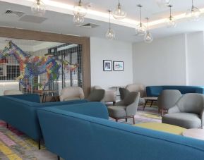 Lobby and coworking lounge at Hampton By Hilton Hamilton Park.
