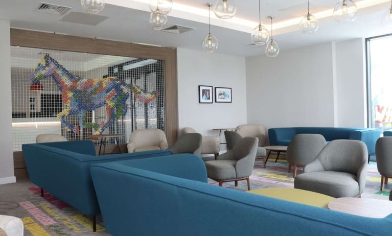 Lobby and coworking lounge at Hampton By Hilton Hamilton Park.
