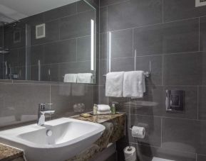 Guest bathroom with shower at DoubleTree By Hilton Bristol City Centre.  