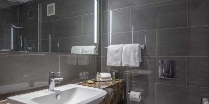 Guest bathroom with shower at DoubleTree By Hilton Bristol City Centre.  